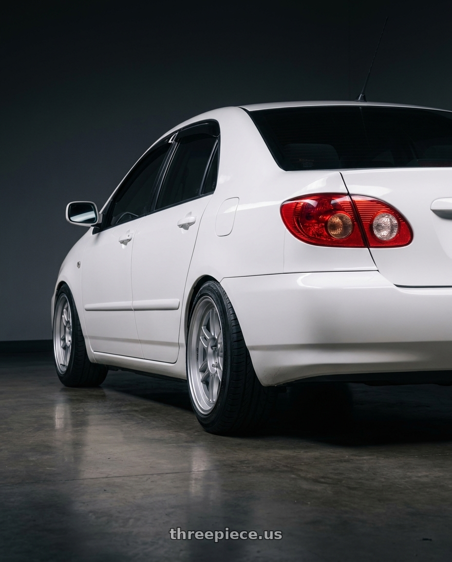 2006 corolla 9gen with Enkei RPF1 4x100 16x7+43 Silver wheels rear three quarter view extreme stretch tires