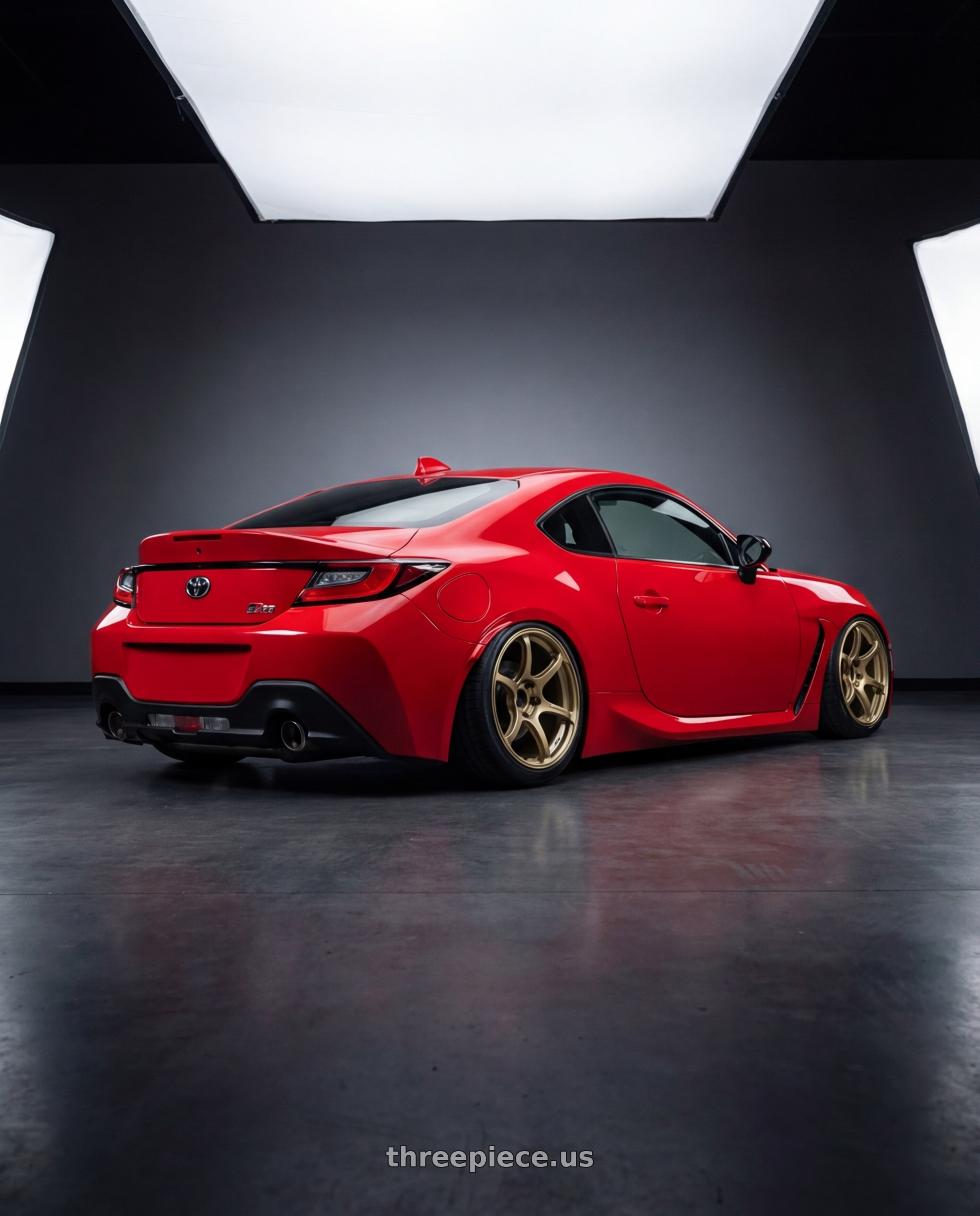 2024 Toyota GR86 with Advan RGIII 5x114.3 18x8.0+45 Gold wheels rear three quarter view slight stretch tires