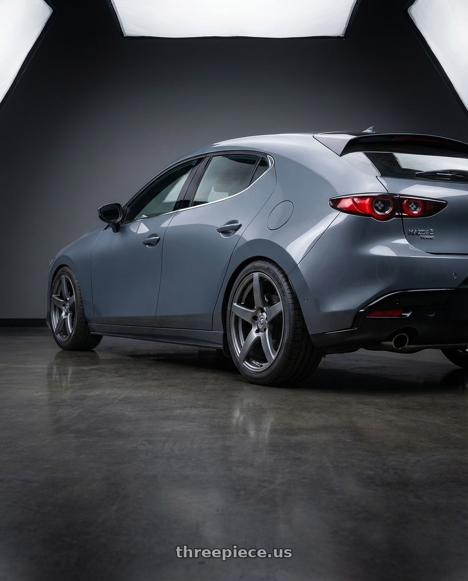 2023 Mazda Mazda3 Turbo with Forgestar CF5 5x114.3 18x10 +42 Gloss Anthracite wheels rear three quarter view square tires