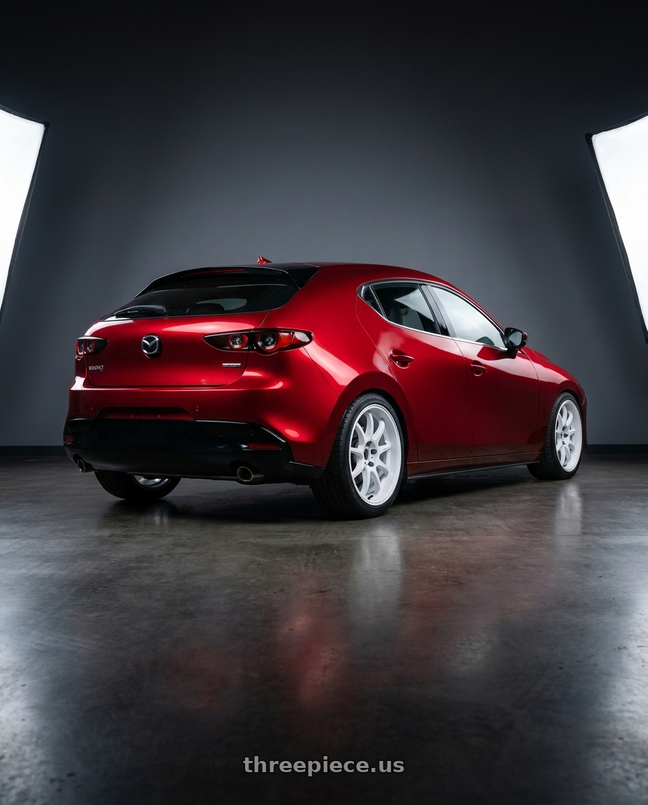 2026 Mazda 3 hatchback soul red with Work Emotion D9r 5x114.3 18x8.5 +38 White wheels rear three quarter view square tires
