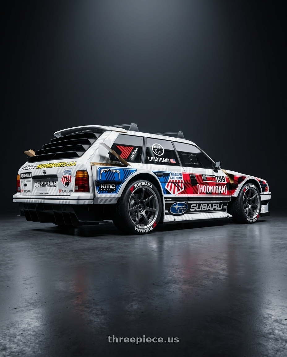 1983 subaru gl wagon with hoonigan wide body kit aero,hoonigan livery,Yokohama tires paint, silver brake with Work Emotion T7R 2P wheels rear three quarter view square tires