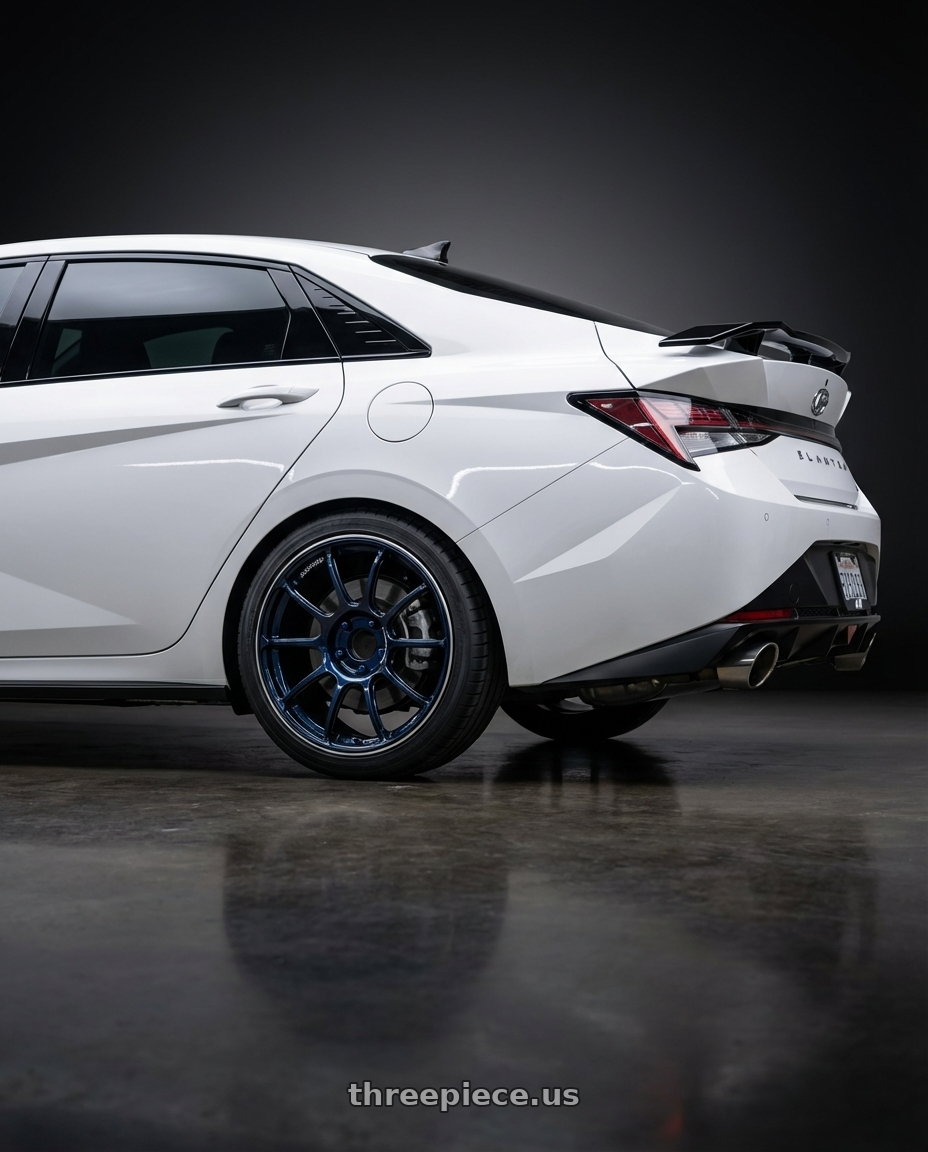 2024 Hyundai Elantra N with Advan RZ II 5x114.3 19x10+25 Racing Indigo Blue and Ring wheels rear three quarter view square tires