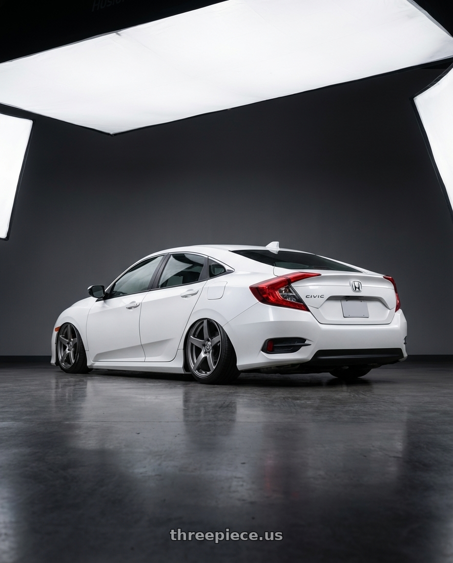 2019 Honda Civic with Forgestar CF5 5x114.3 19x10 +42 Gloss Anthracite wheels rear three quarter view slight stretch tires