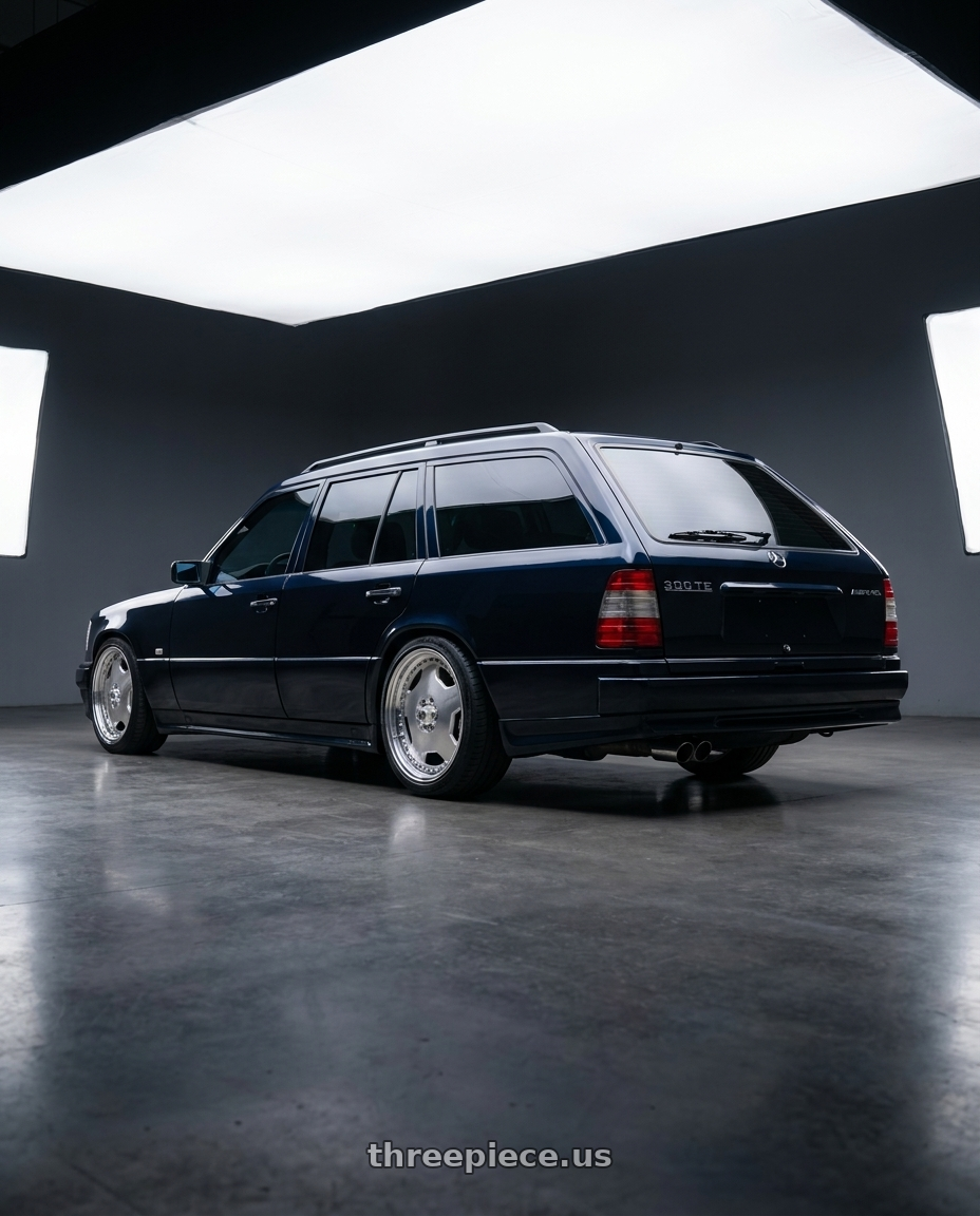 1995 mercedes 300TE midnight blue with Center Line Convo Pro 2.0 5X120.65 15x4 -6 Polished wheels rear three quarter view slight stretch tires