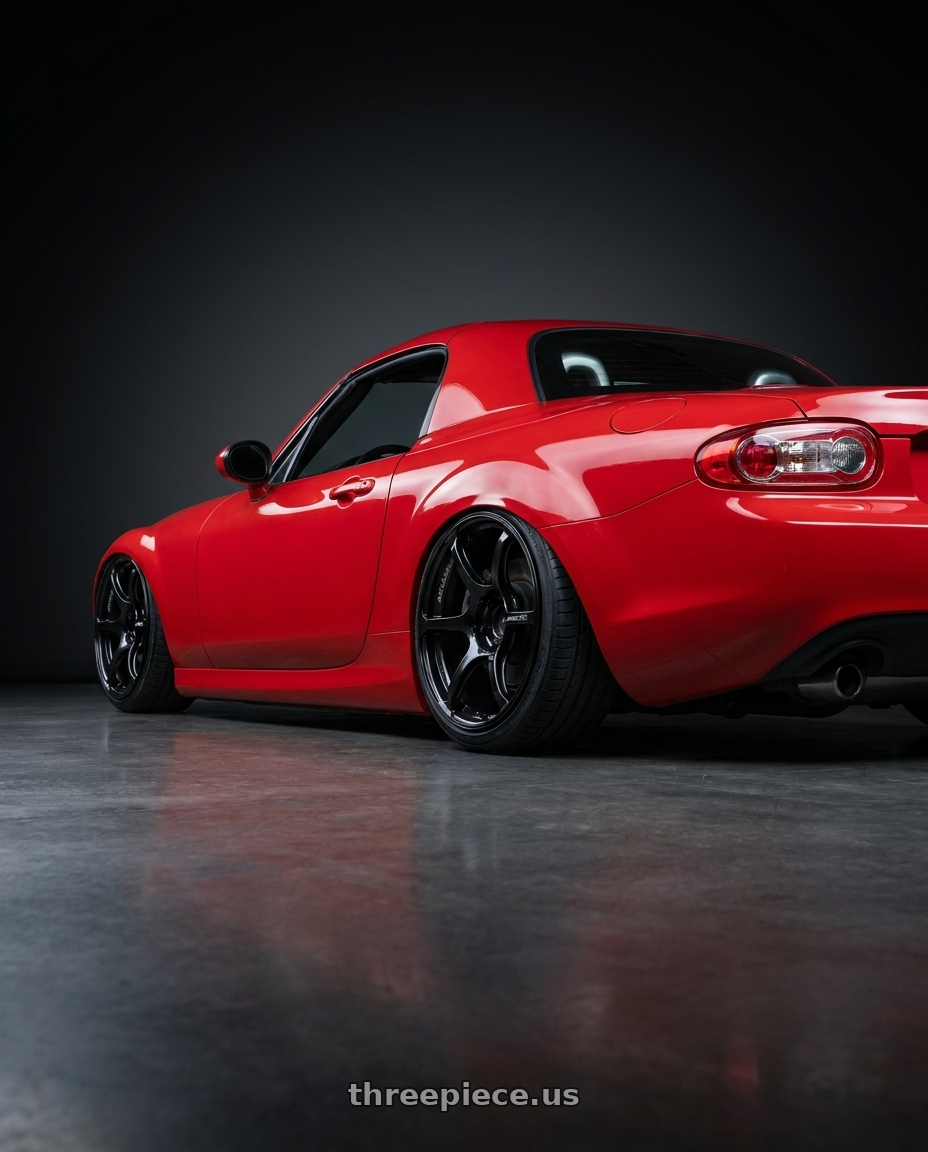 2012 Mazda MX-5 Miata NC with Advan RGIII 5x114.3 17x8.5+31 Gloss Black wheels rear three quarter view slight stretch tires
