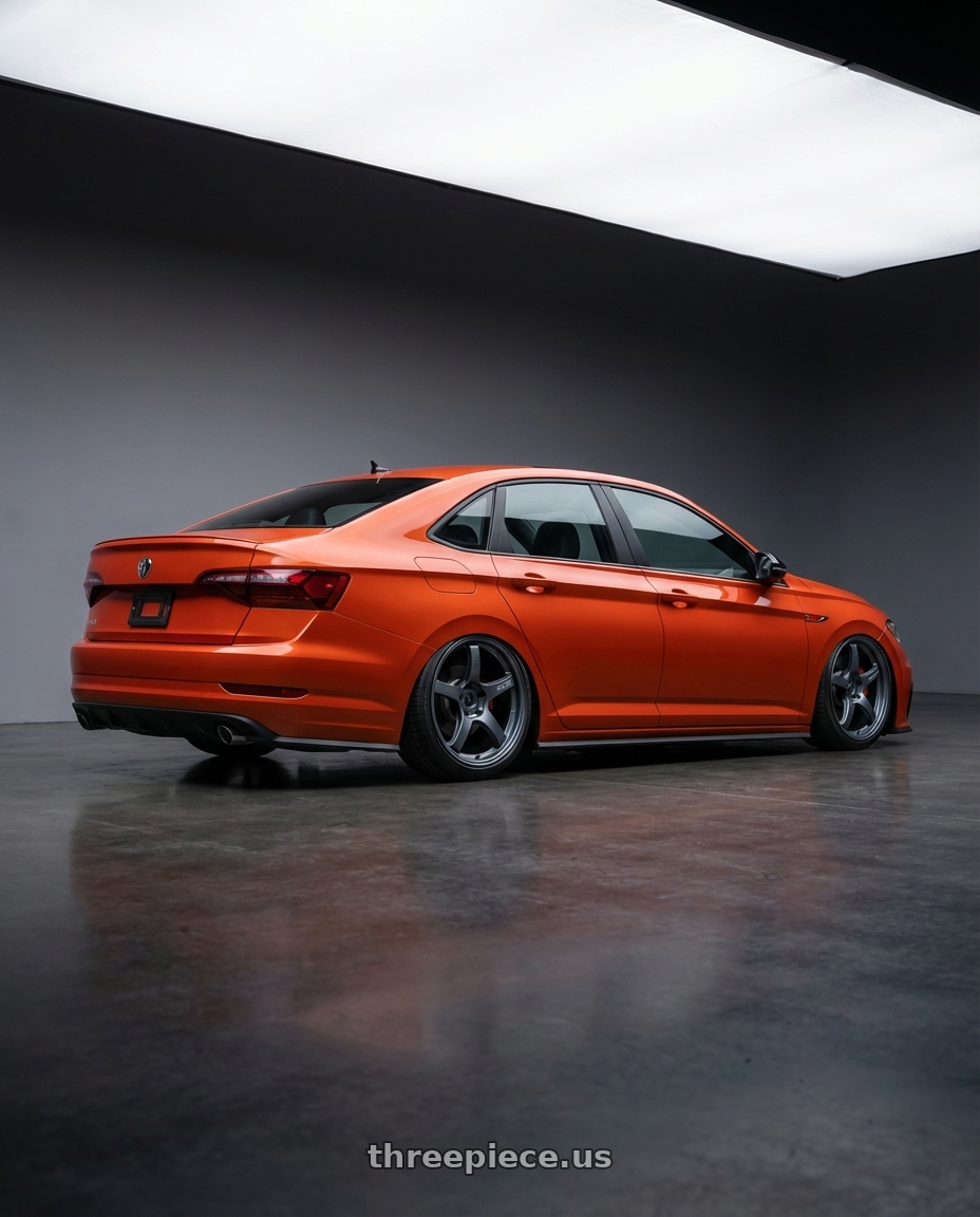 2023 Volkswagen Jetta GLI MK7 with Gram Lights 57CR 5x112 19x10.5+22 Gunblue II wheels rear three quarter view slight stretch tires