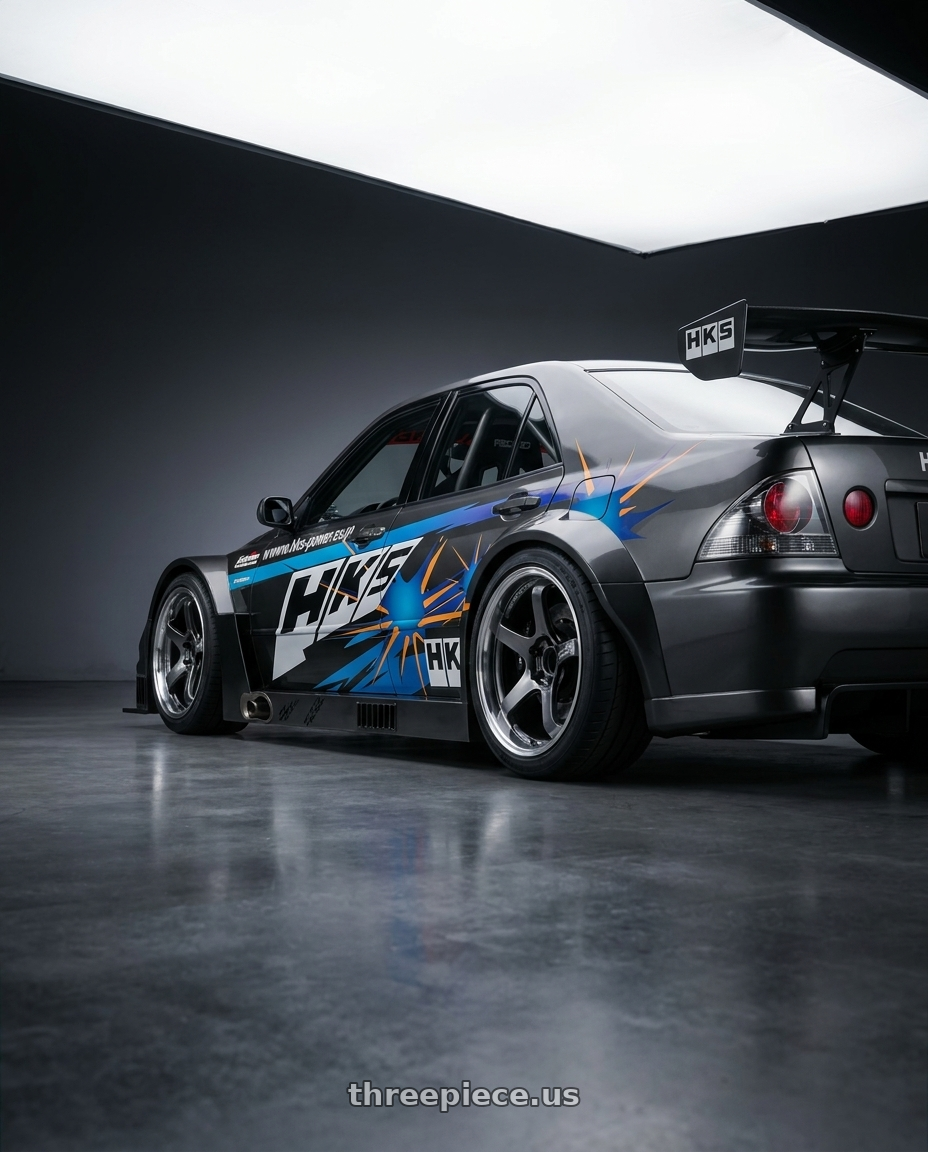 2001 toyota altezza with hks time attack wide body kit,big wing,black brake,hks livery,racecar interior, with Advan Racing GT BEYOND 5x114.3 18x9.5 +45 MACHINING & HYPER PLATINUM BLACK wheels rear three quarter view square tires