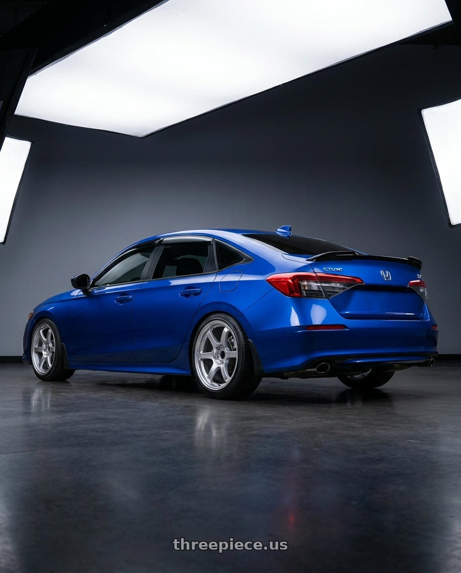 2023 Honda Civic Si Aegean Blue Metallic with Gram Lights 57DR 5x114.3 18x9.5+38 Grace Silver wheels rear three quarter view slight stretch tires
