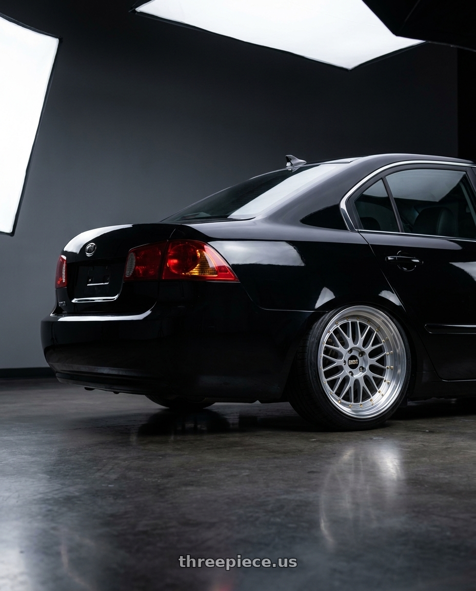 2007 Kia optima Black with BBS LM 5x114.3 17x7.5+38 Diamond Silver wheels rear three quarter view square tires