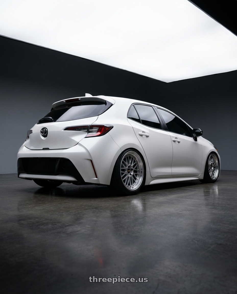2021 toyota corolla hatchback white with BBS LM 5x114.3 18x10.0+25 Diamond Silver wheels rear three quarter view slight stretch tires