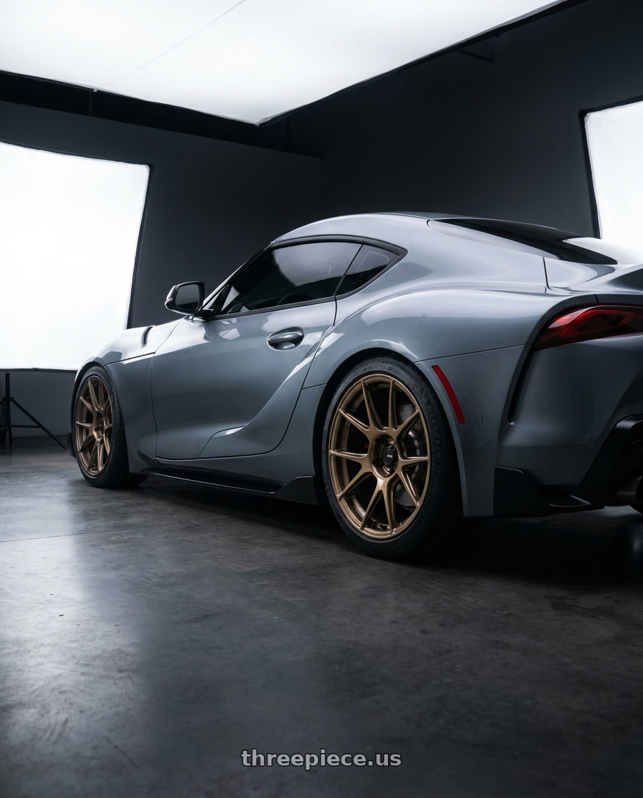 2020 Toyota GR Supra with Konig Ampliform 5x112 18x8.5+43 Gloss Bronze wheels rear three quarter view square tires