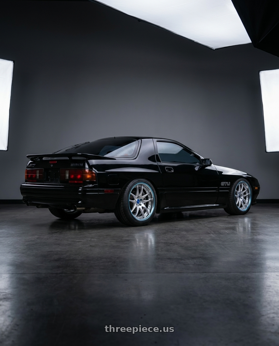 1990 Mazda RX7 GTU black with Work Emotion CR 3P wheels rear three quarter view meaty tires