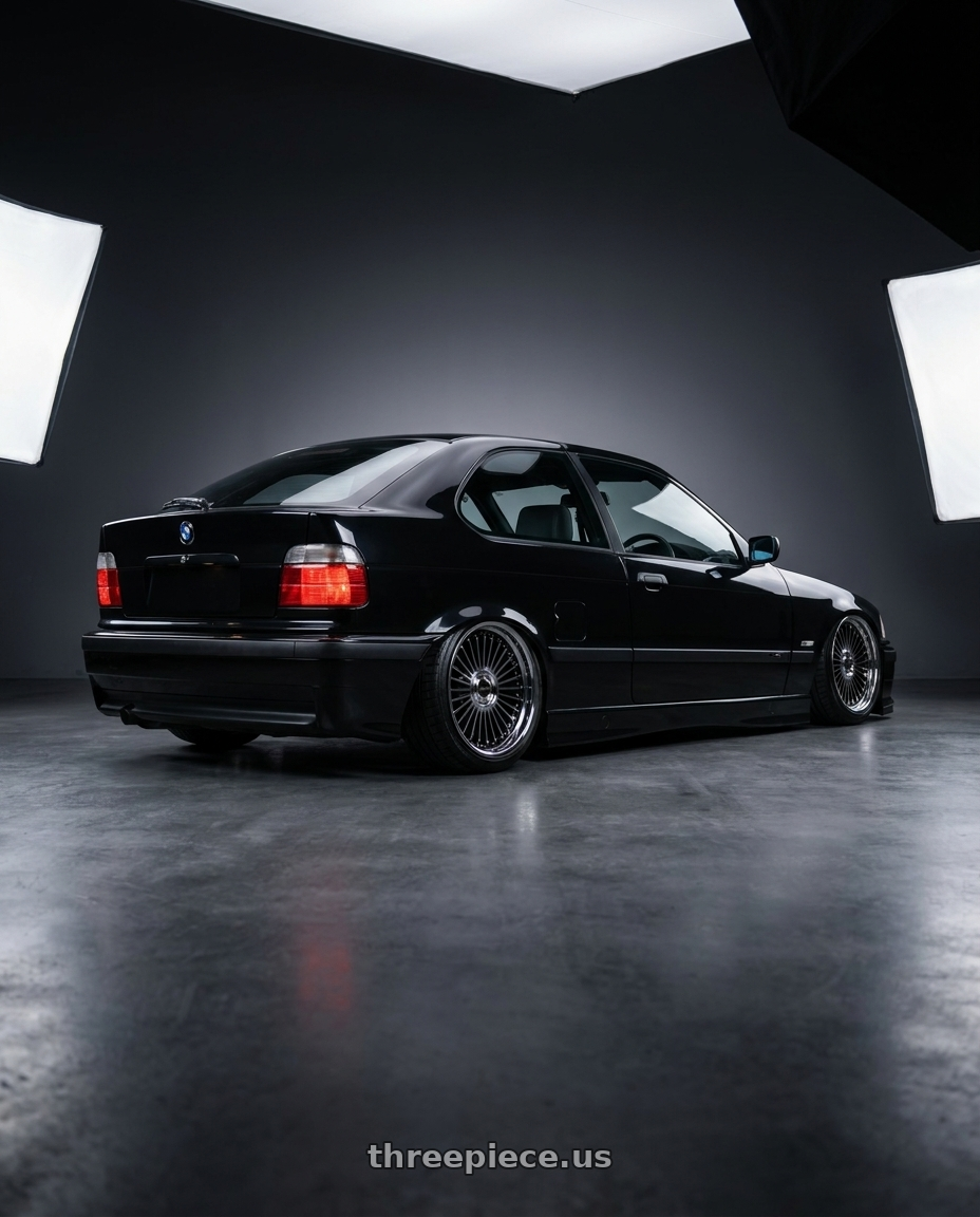 1998 bmw 318ti base black with Work Emitz Black Polish 5x120 19x8.0 +38 wheels rear three quarter view slight stretch tires