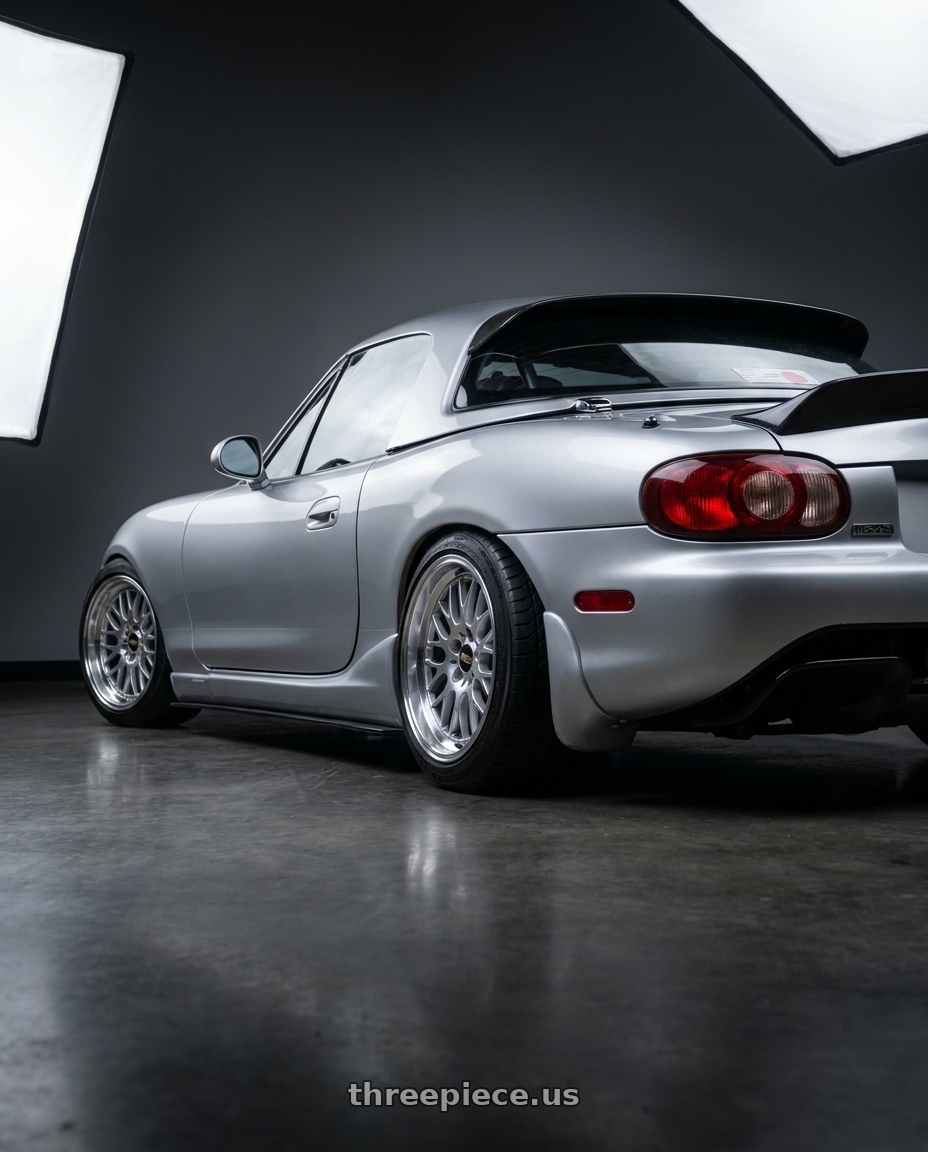 2000 Mazda Miata with BBS RG-R 5x120 17x9.0+42 Diamond Silver wheels rear three quarter view extreme stretch tires