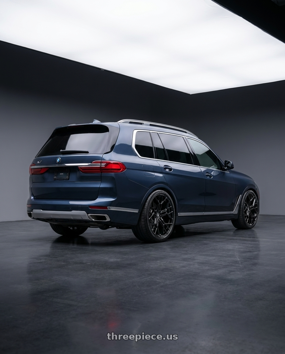 2026 BMW X7 with Fittipaldi FS371B 5x112 22x9 +35 Gloss Black wheels rear three quarter view square tires