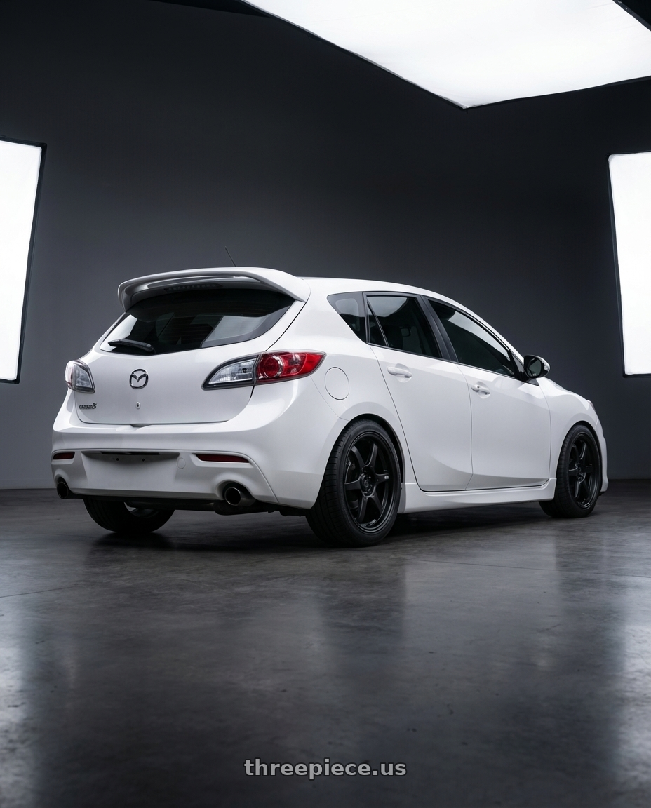 2012 Mazda Mazdaspeed3 with Konig Backbone 5x114.3 18x8+35 Matte Black Milling Logo on Spoke wheels rear three quarter view square tires