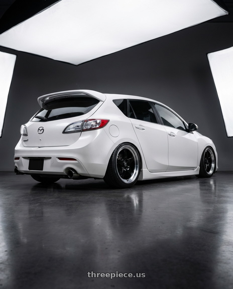 2012 Mazda Mazdaspeed3 with Forgestar D5 Drag 5x114.3 18x10 +22 Gloss Black Machined wheels rear three quarter view slight stretch tires