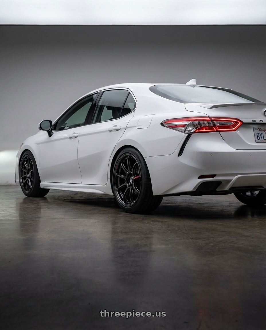 2026 Toyota Camry  with Work Zr10 2P 5x120 18x9.0 +38 Glim Black wheels rear three quarter view square tires
