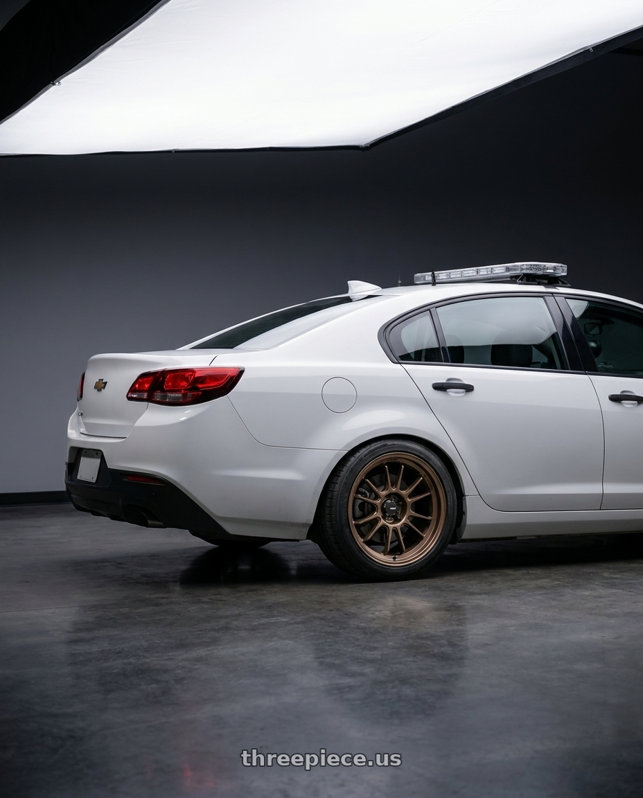 2016 Chevy Police with Konig Hypergram 5x114.3 18x10.5+25 Race Bronze wheels rear three quarter view square tires