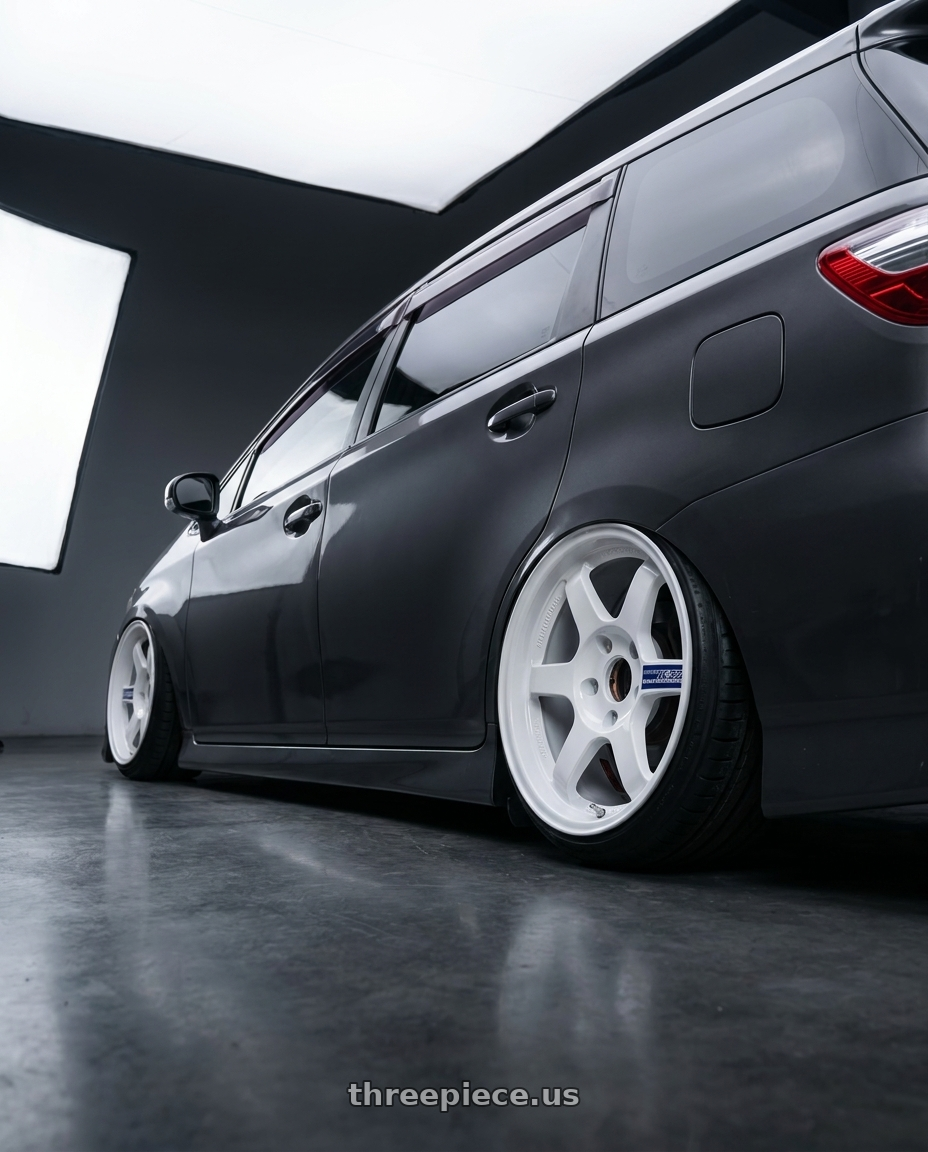 2010 TOYOTA WISH with Volk Racing TE37 Gravel 5x114.3 15x7.0+35 White wheels rear three quarter view extreme stretch tires