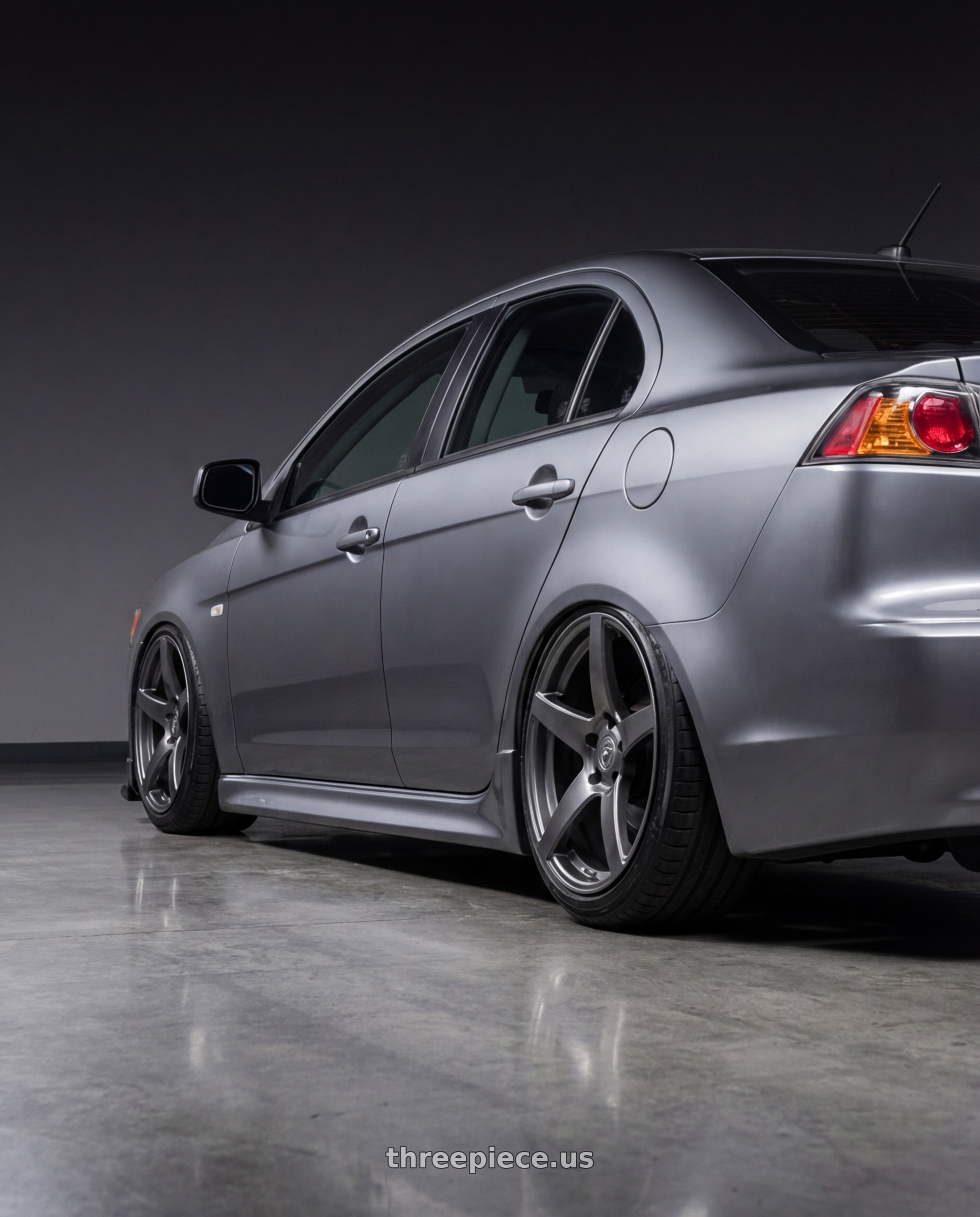 2014 Mitsubishi Lancer Ralliart with Forgestar CF5 5x114.3 18x10 +42 Gloss Anthracite wheels rear three quarter view slight stretch tires