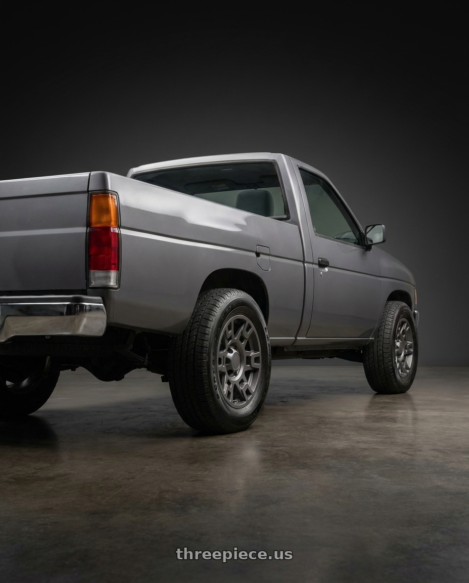 1994 Nissan D21 XE with OE Wheels TY16B 6x139.7 17x7+4 Satin Graphite wheels rear three quarter view meaty tires