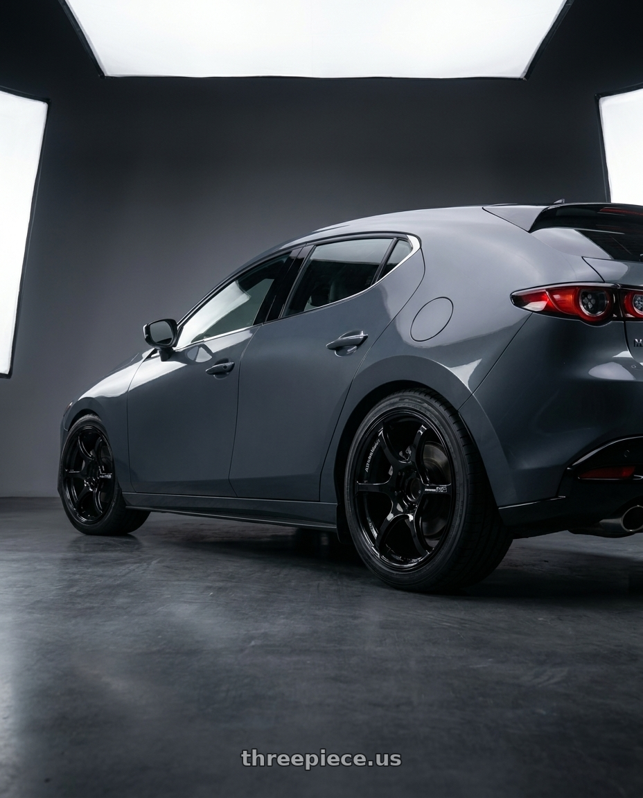 2024 Mazda3 Fastback  with Advan RGIII 5x114.3 18x8.0+45 Gloss Black wheels rear three quarter view square tires