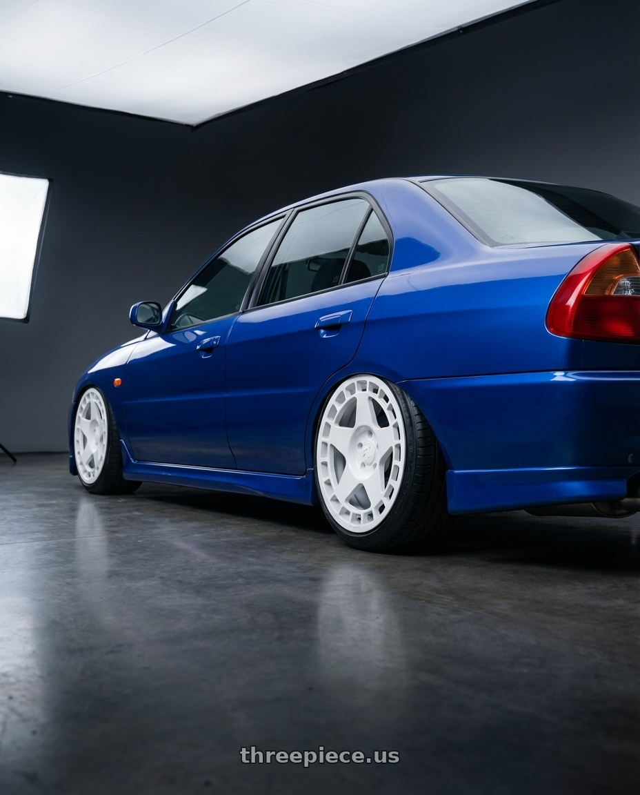 1998 Mitsubishi lancer with fifteen52 TURBOMAC 5x114.3 18x8.5 +30 RALLY WHITE (GLOSS WHITE) wheels rear three quarter view slight stretch tires