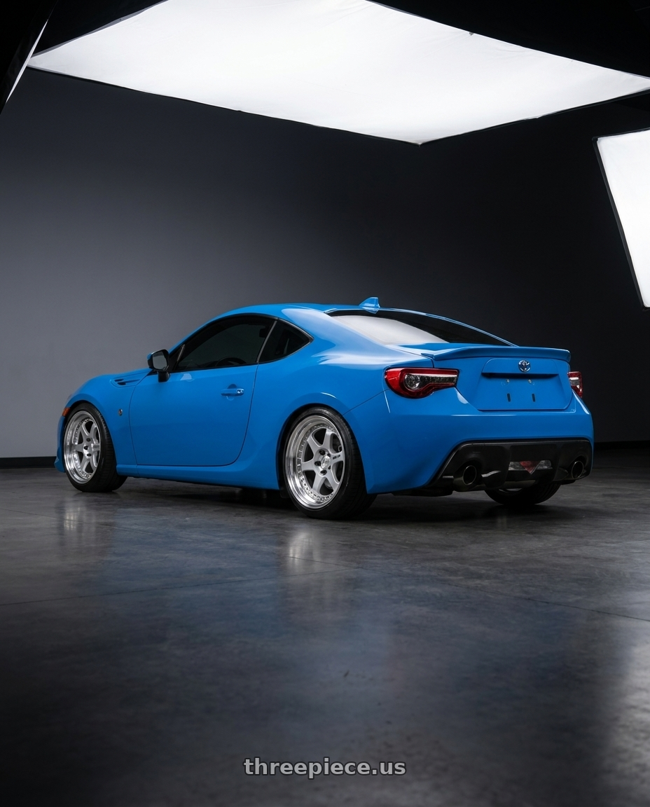 2019 Toyota 86 with Work Meister L1 3P 5x114.3 18x8.5-20 L Disk Matte Silver wheels rear three quarter view slight stretch tires