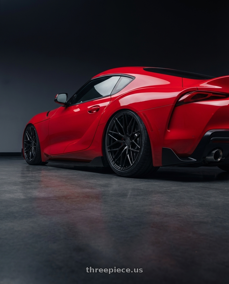 2023 Toyota GR Supra with Avant Garde Wheels M520R 5X112 19x8.5 +35 Gloss Black wheels rear three quarter view slight stretch tires