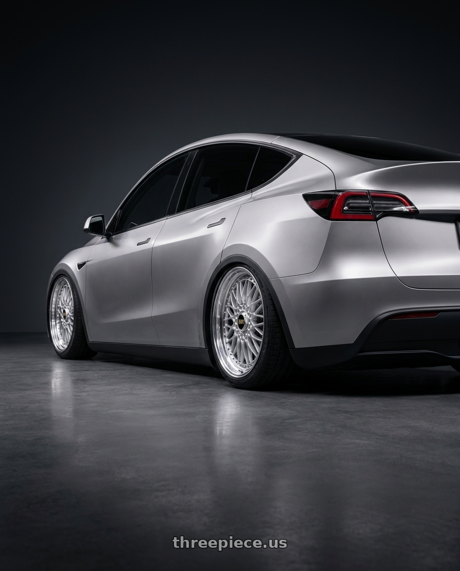 2026 Tesla Y oreium with BBS Super-RS 5x112 19x9.0+42 Silver wheels rear three quarter view square tires