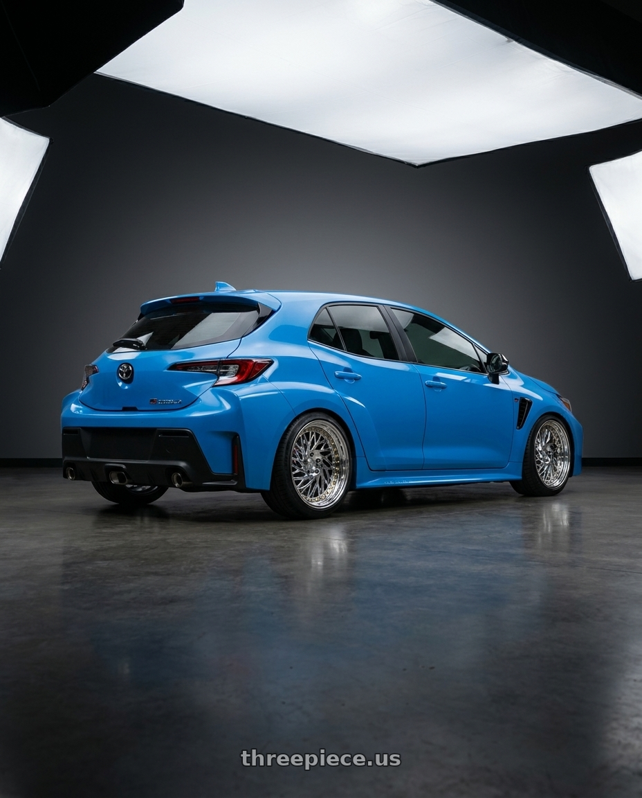 2024 Toyota GR Corolla with Aodhan DS03 5x114.3 18x9.5 +30 Vacuum Chrome w/Gold Rivets wheels rear three quarter view square tires