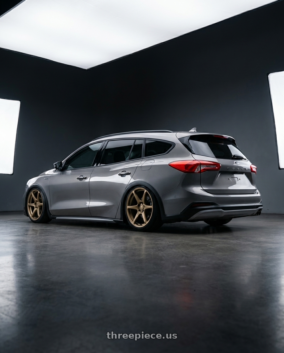 2023 Focus active wagon with Kansei K11B Tandem 5X108 18x8.5 35 Bronze wheels rear three quarter view slight stretch tires