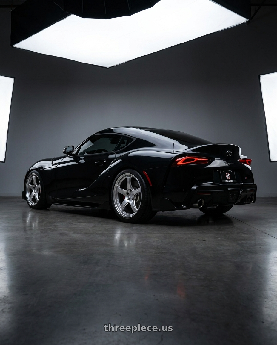 2026 toyota supra with Gram Lights 57CR 5x112 19x9.5 +25 GRACE SILVER wheels rear three quarter view square tires
