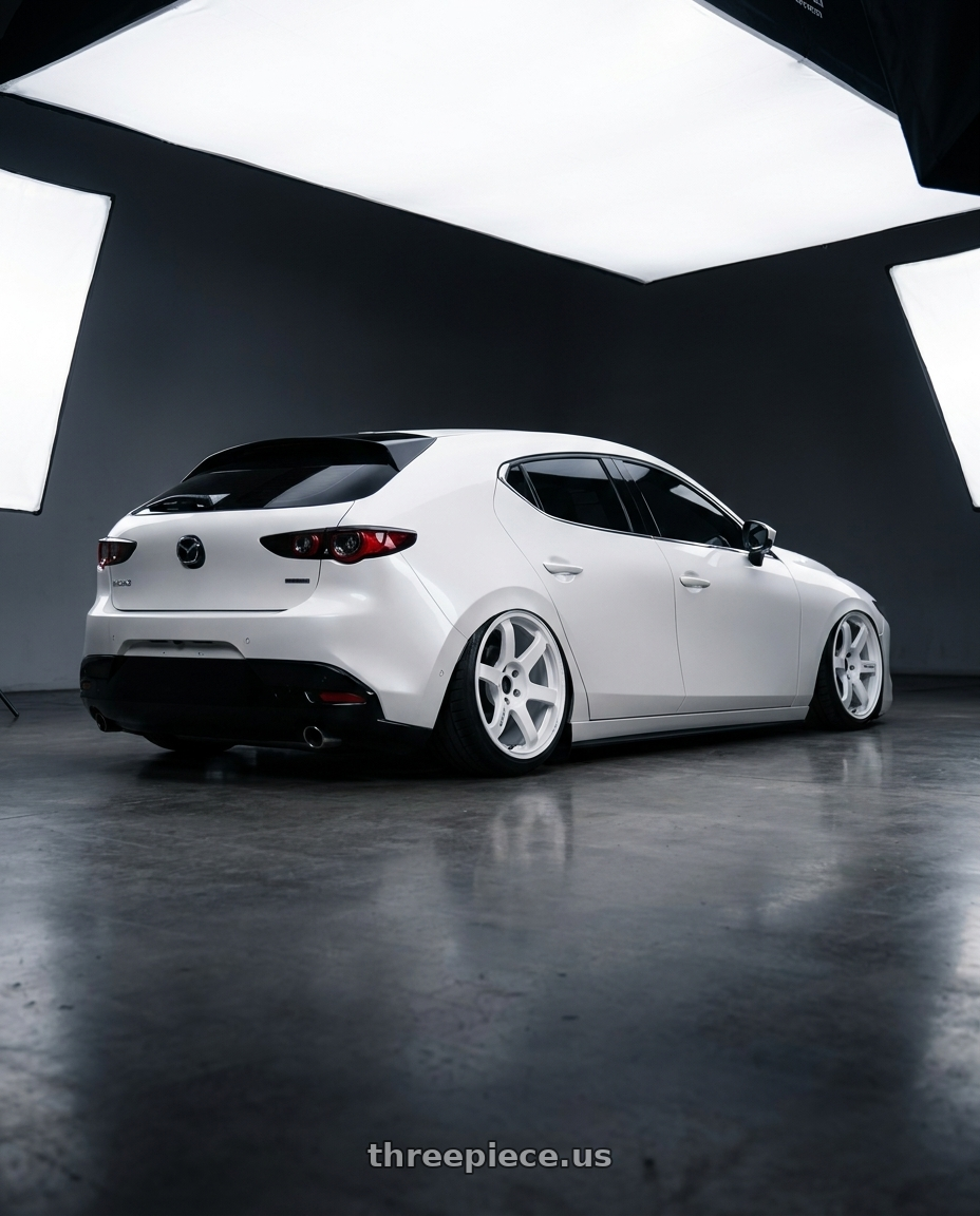 2023 MAZDA3 BP with Volk Racing TE37 SAGA S-PLUS 5x120 18x9.5 +20 DASH WHITE wheels rear three quarter view square tires