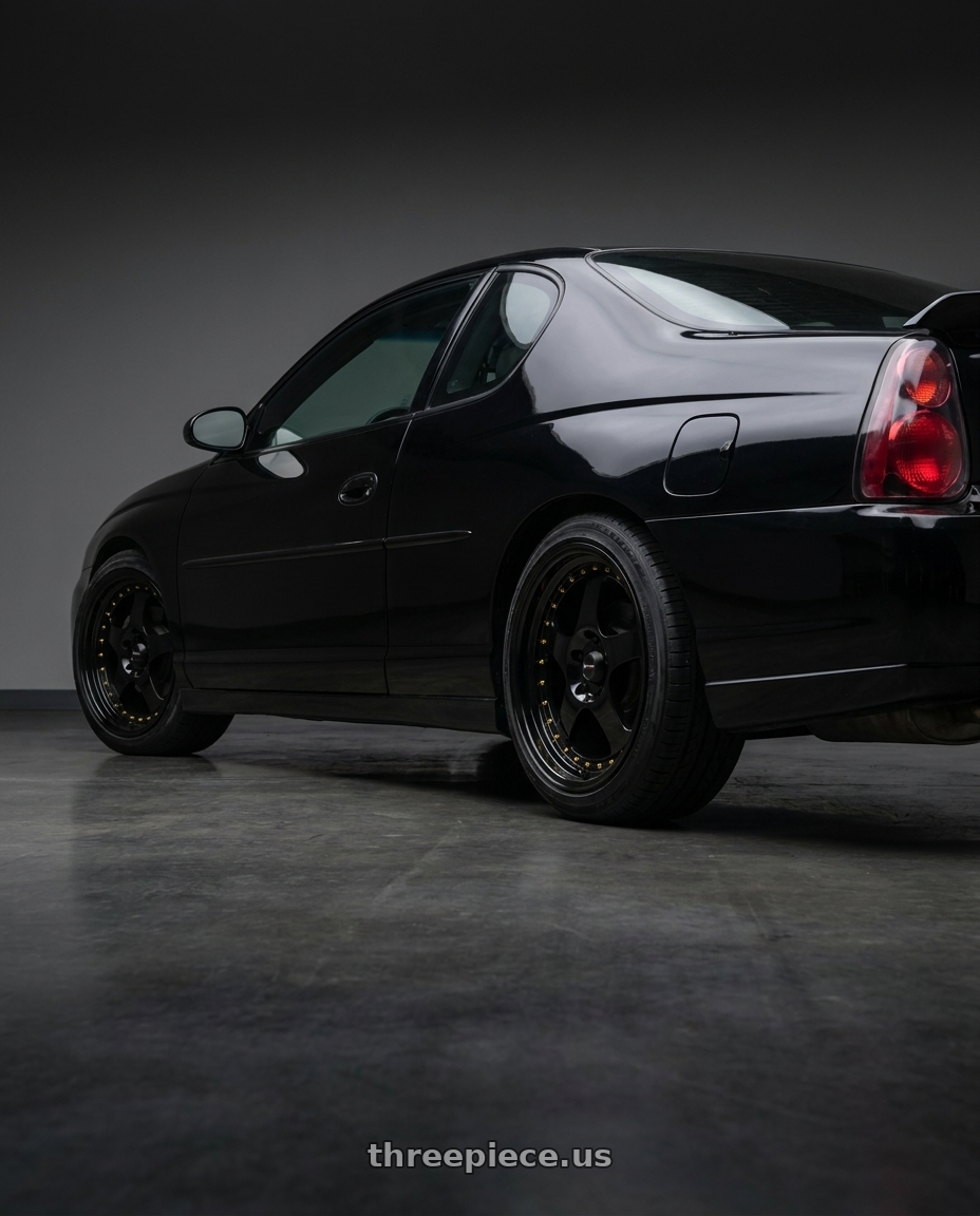 2005 Chevy Monte Carlo with Vors VR2 5x115 18x9  +35 All Black Gold Rivet wheels rear three quarter view square tires