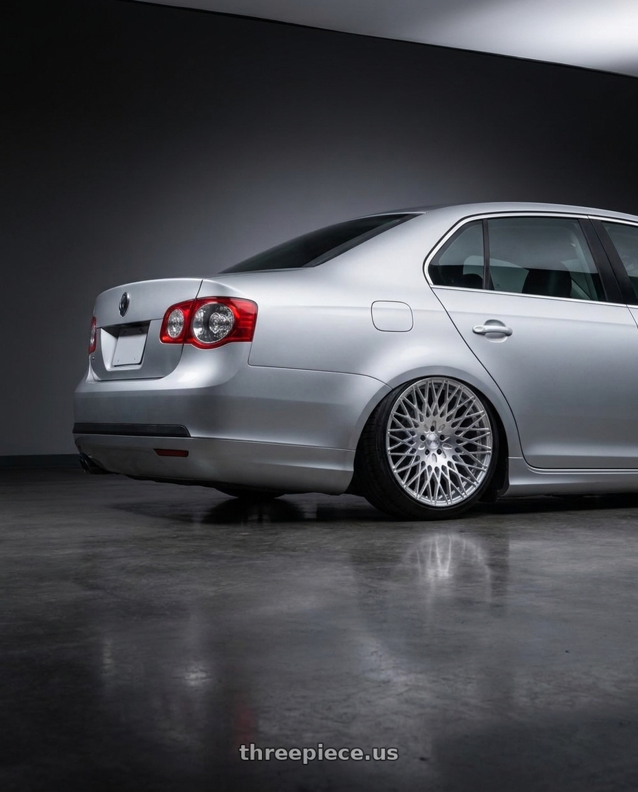 2009 Volkswagen Jetta GLI MK5 with Avant Garde Wheels M540 5X112 18x9 +48 Silver Machined wheels rear three quarter view slight stretch tires