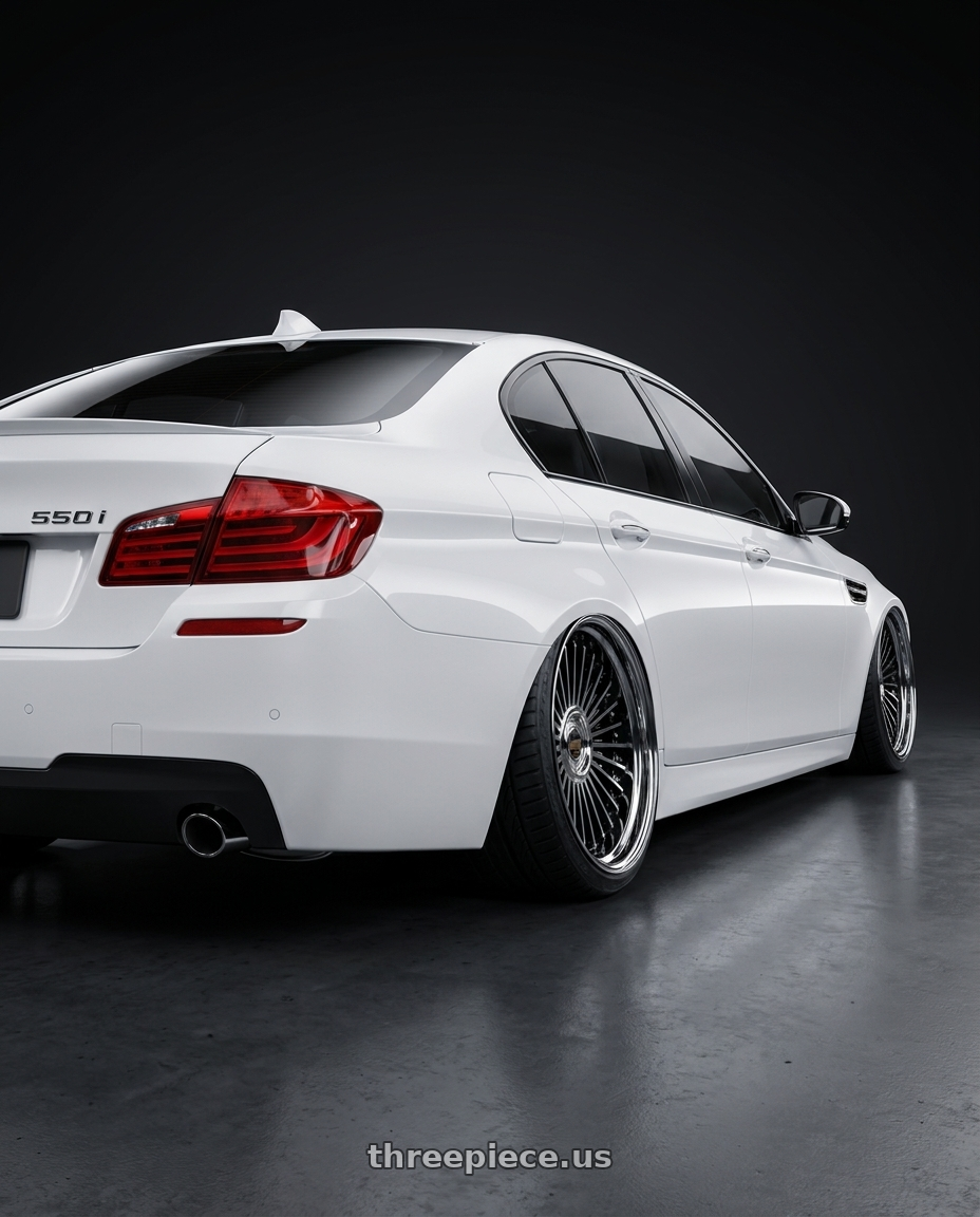 2013 BMW 550i with Work Emitz Black Polish 5x105 20x12.0 +45 wheels rear three quarter view extreme stretch tires