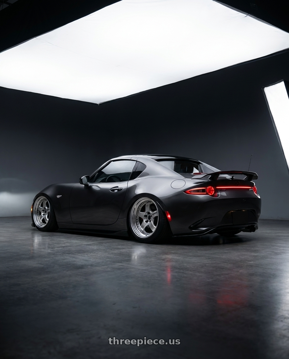 2017 Mazda Miata with Work Meister S1 3P 4x100 17x7+36 W Disk Silver wheels rear three quarter view slight stretch tires