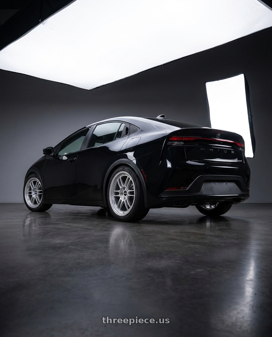 2025 Toyota Prius  with Enkei RPF1 4x100 14x7+19 Silver wheels rear three quarter view square tires