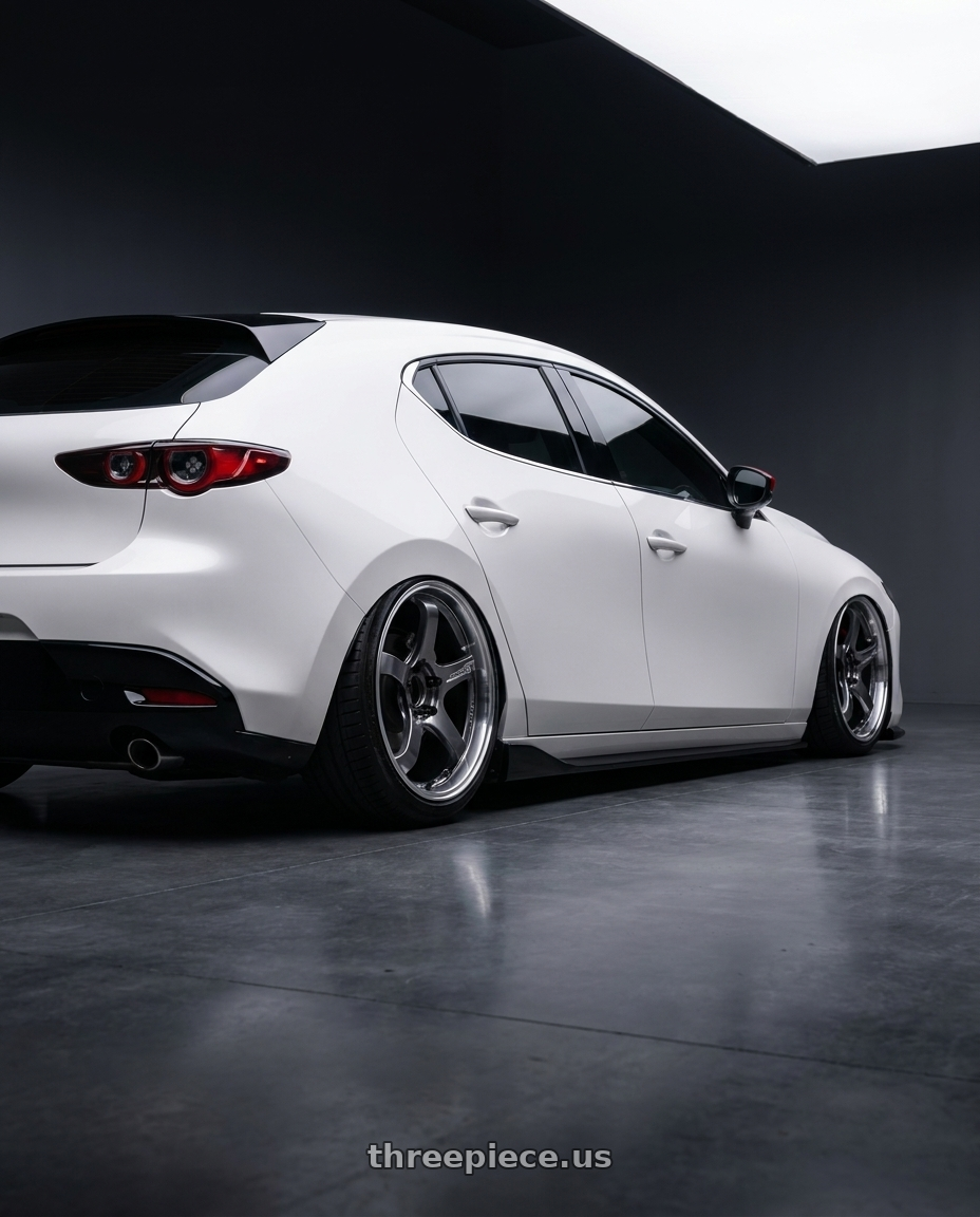 2024 Mazda Mazda3 Fastback  with Advan Racing GT BEYOND 5x114.3 19x8.5 +37 MACHINING & HYPER PLATINUM BLACK wheels rear three quarter view slight stretch tires