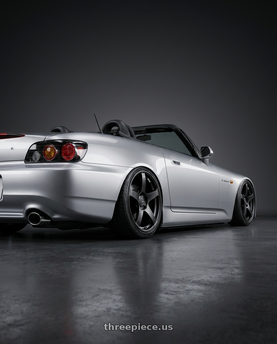 2009 Honda S2000 with Ssr Gtv01 5x114.3 17x7+42  FLAT BLACK wheels rear three quarter view slight stretch tires