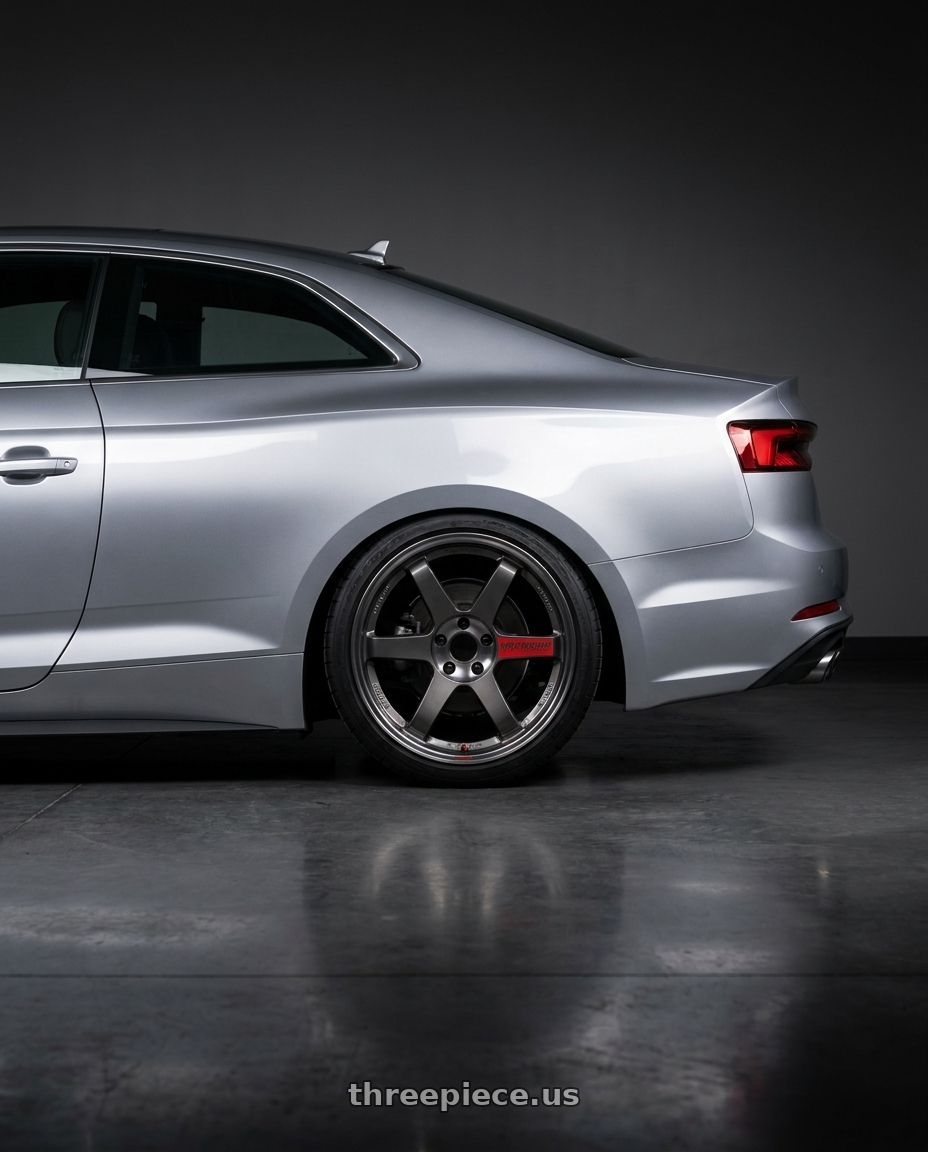 2018 Audi A5 with Volk Racing TE37SL 5x112 19x9.5 +22 PRESSED GRAPHITE wheels rear three quarter view square tires