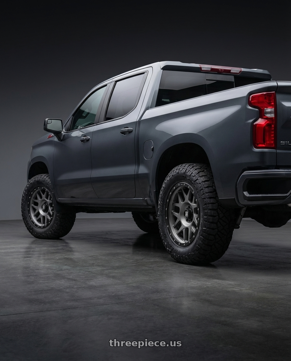 2023 Chevrolet Silverado 1500 with XD XD127 BULLY 6X139.7 20X9 +18 MATTE GRAY BLACK RING wheels rear three quarter view meaty tires