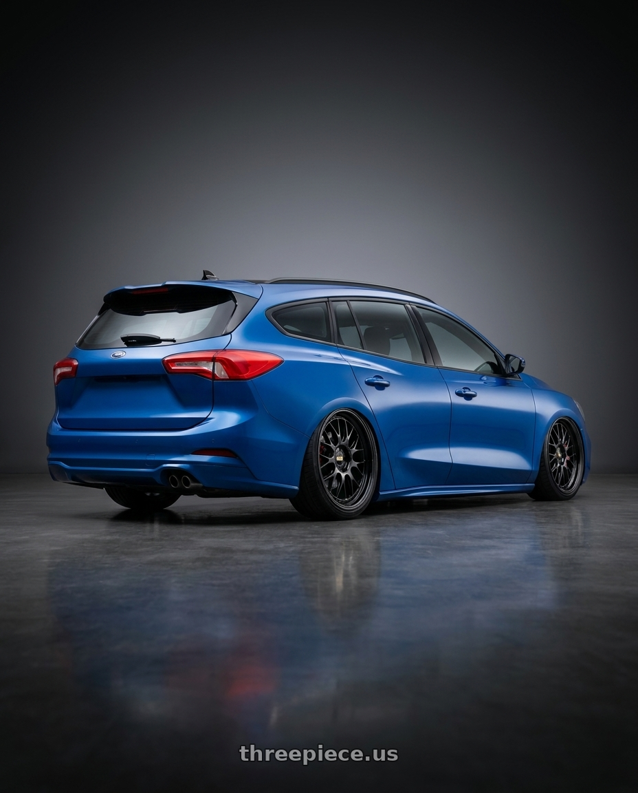 2023 Ford focus wagon with BBS LM-R 5x112 19x9.0+44 Diamond Black wheels rear three quarter view square tires