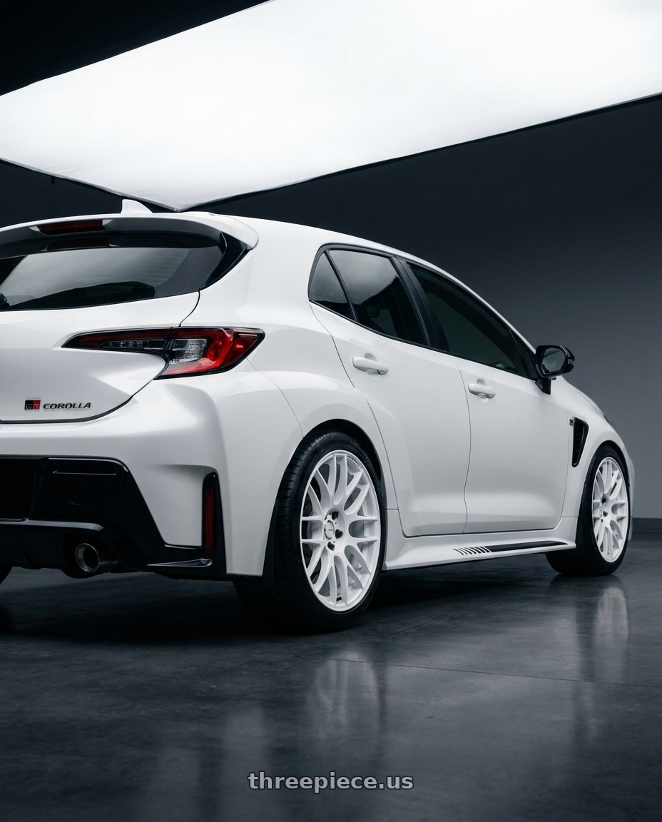 2025 Toyota GR Corolla with Work Emotion m8r 5x114.3 18x8.5 +30 White wheels rear three quarter view square tires