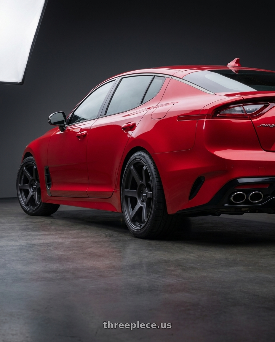 2018 Kia Stinger GT2 AWD with Motegi BATTLE VI 5x114.3 19x9.5 +40 Matte Blackbird Metallic wheels rear three quarter view square tires