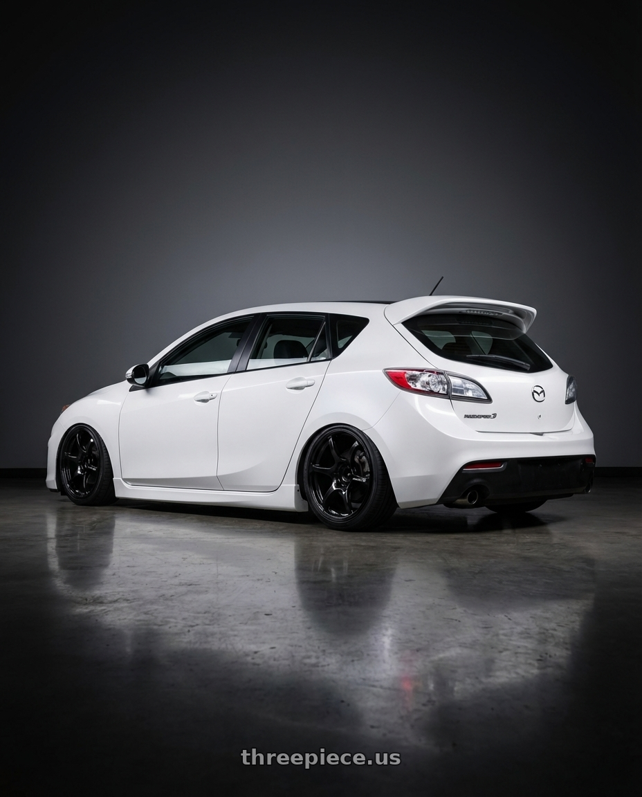 2012 Mazda Mazdaspeed3 with Advan RGIII 5x114.3 18x9.5+45 Gloss Black wheels rear three quarter view slight stretch tires