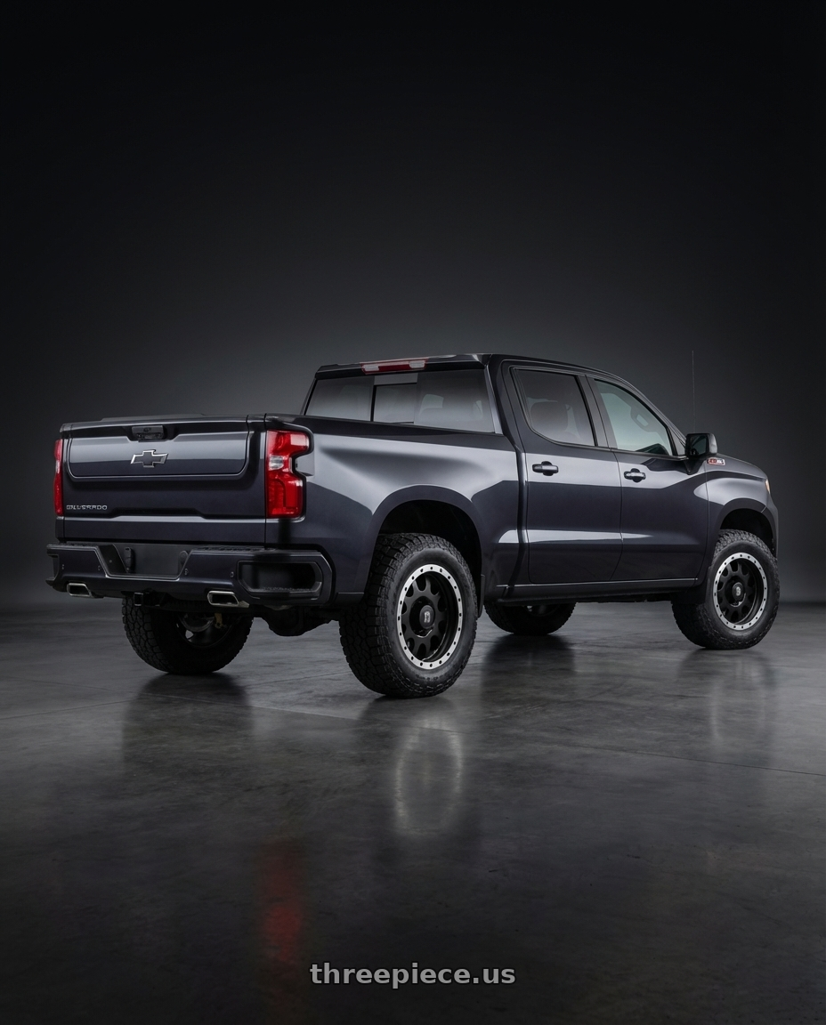 2023 Chevrolet Silverado 1500 with XD XD125 6X139.7 20X9 +18 MATTE BLACK WITH MACHINED REINFORCING RING wheels rear three quarter view meaty tires