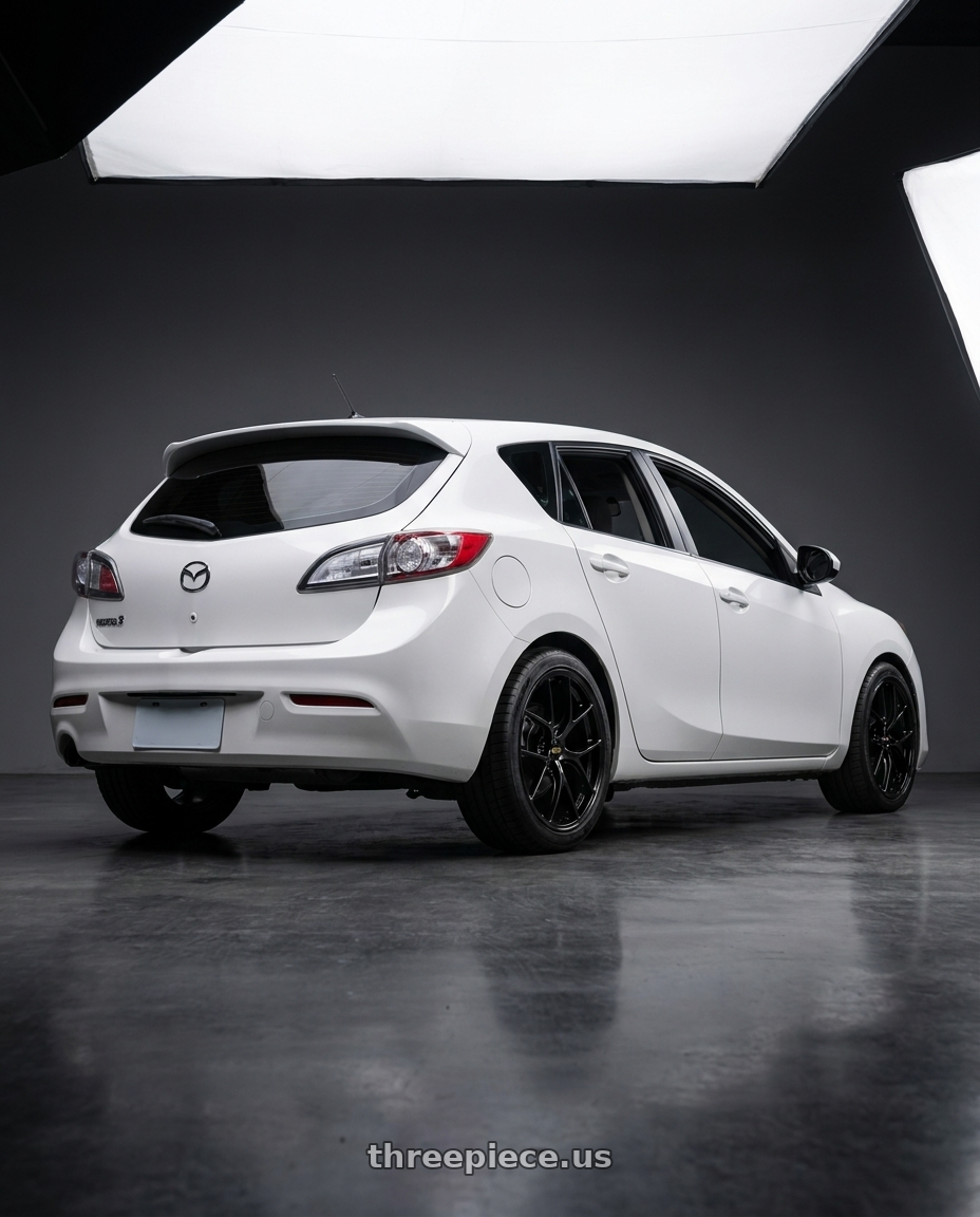 2013 Mazda3 BL with BBS RI-D 5x108 19x9 +28 Diamond Black wheels rear three quarter view square tires